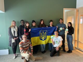 EKOenergy team holding a Ukrainian flag