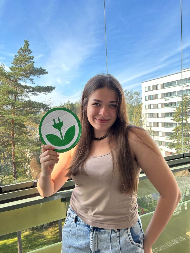Kateryna holding an EKOenergy logo