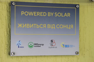 A sign saying “Powered by solar” at a kindergarten in Borodianka 
