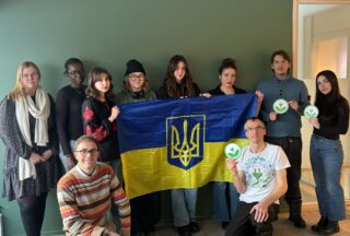 EKOenergy team holding a Ukrainian flag