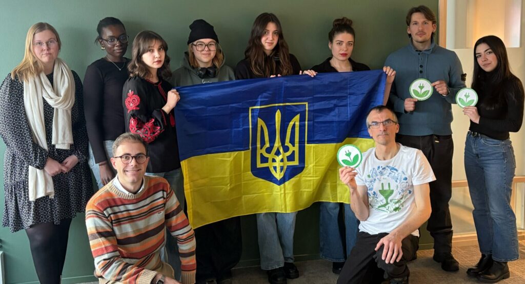 EKOenergy team holding a Ukrainian flag