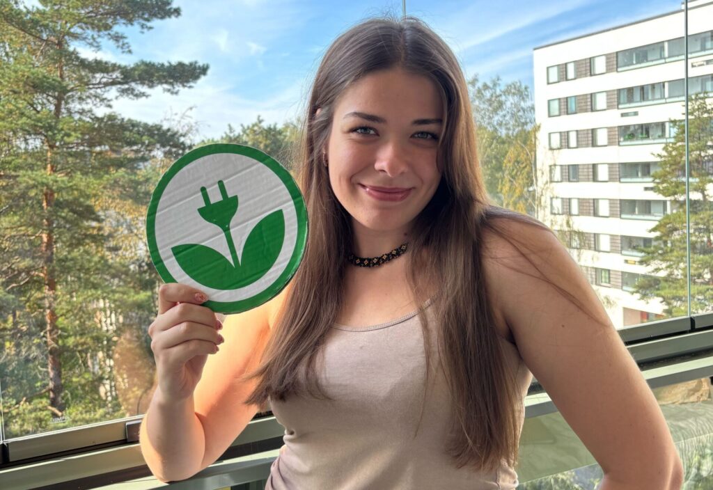 Kateryna holding an EKOenergy logo